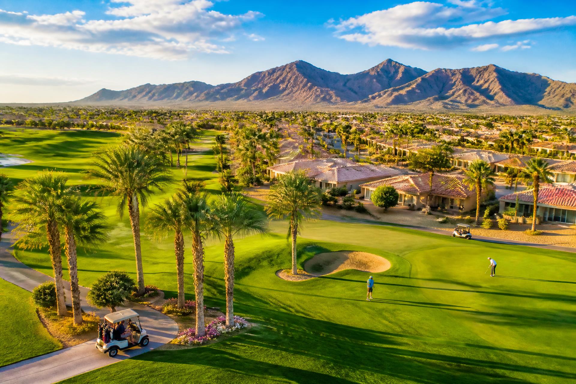 Sun City West Arizona, single-story tile-roof homes along a manicured golf course with desert mountains in distance